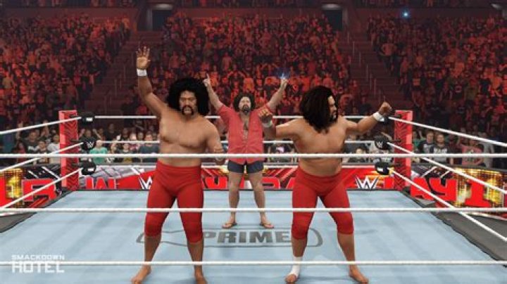 Afa and Sika, The Wild Samoans, with the WWE Tag Team Championship