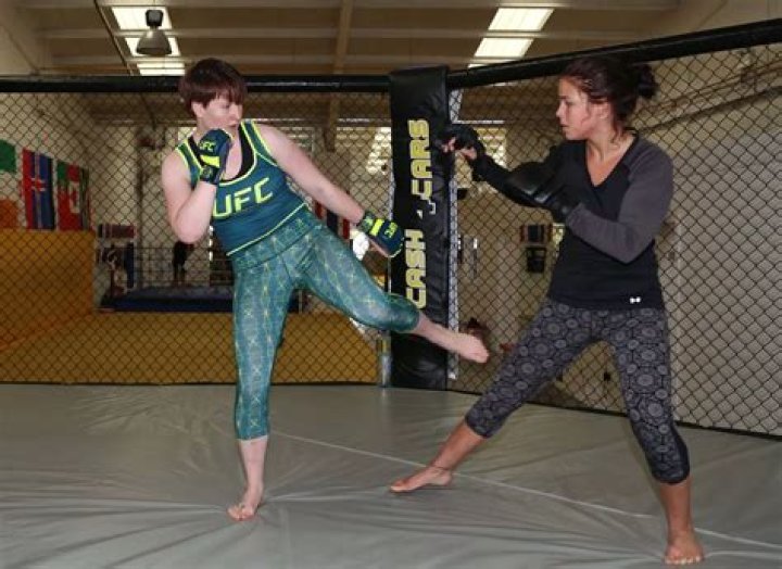 Aisling Daly holds the Irish flag after a UFC fight