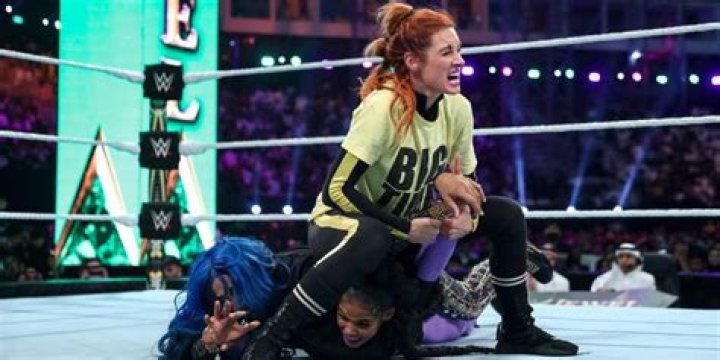 Becky Lynch locks in the Disarmher on Banks and Belair Cropped