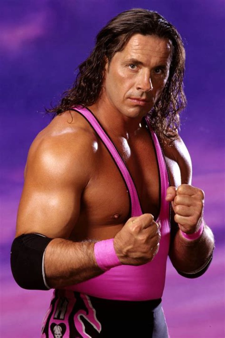 Bret Hart posing in the ring on his first night back in WWE