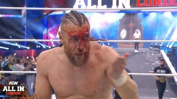 Bryan Danielson posing on AEW top rope.