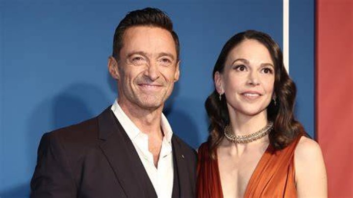 Hugh Jackman kisses costar Rebecca Ferguson as they film a passionate