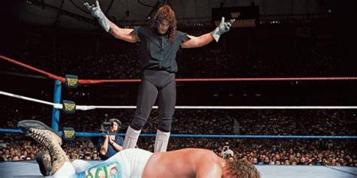 Jake Roberts attacks The Undertaker