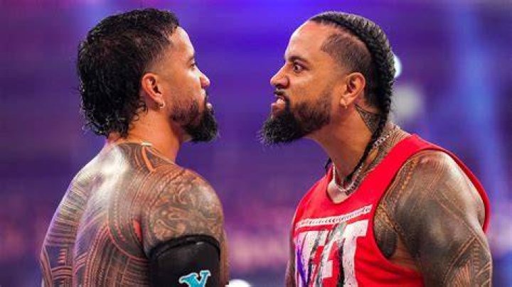 Jimmy and Jey Uso with the WrestleMania 40 logo between them