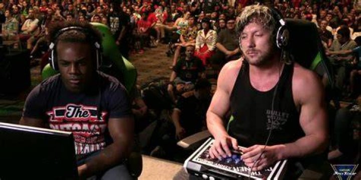 Kenny Omega playing a video game 