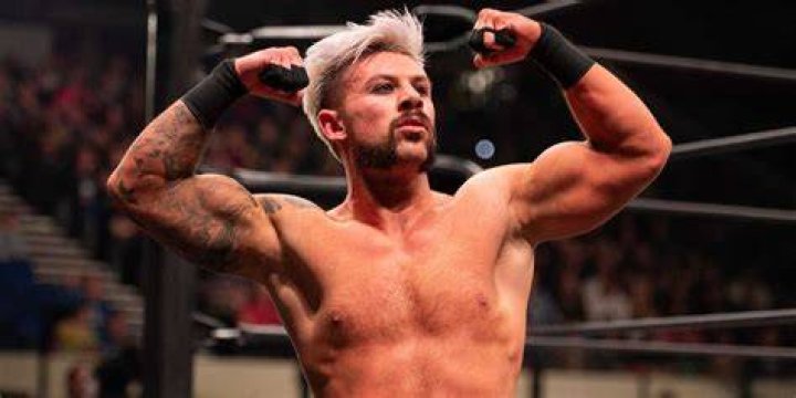 Kip Sabian flexing in the ring 