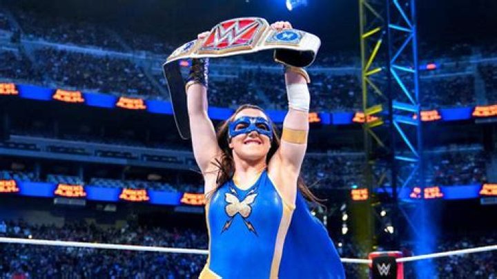 Nikki A.S.H. holding up the Raw Women's Championship.
