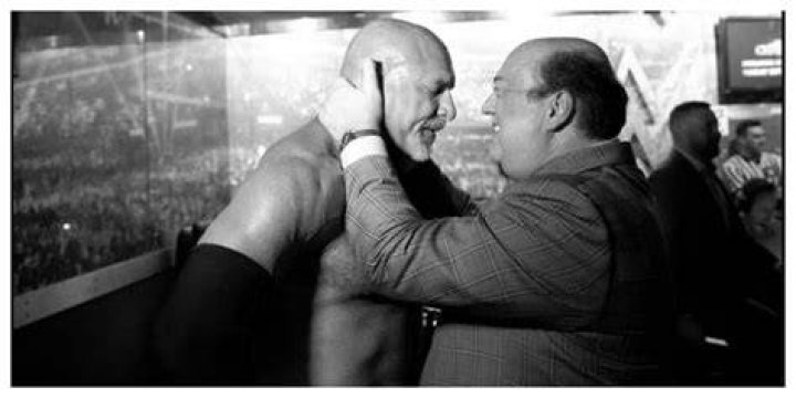 Paul Heyman having a moment with Goldberg backstage