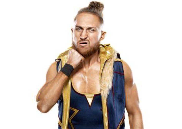 Pete Dunne posing inside the ring 