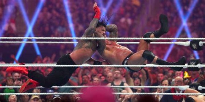Randy Orton RKO's AJ Styles in mid-air Cropped