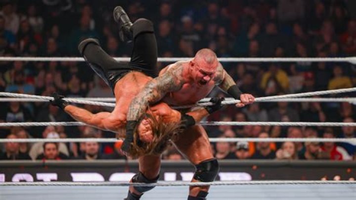 Randy Orton throws Rey Mysterio into the ring post 