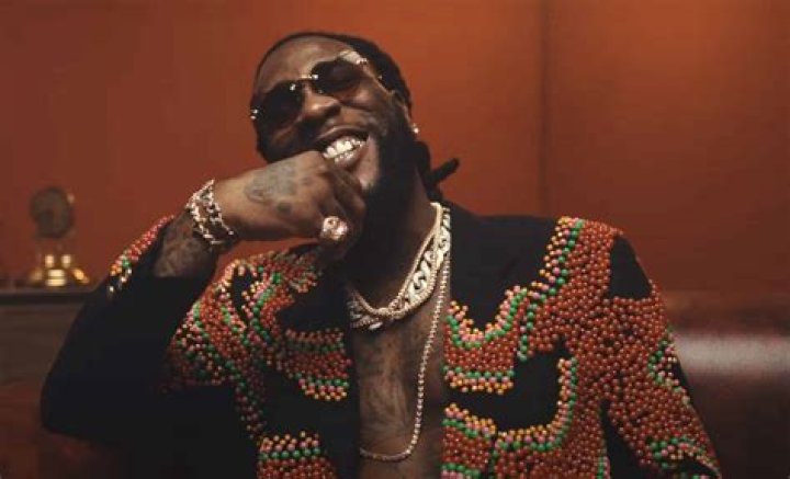 Rare photos of Burna Boy and his father Samuel Ogulu