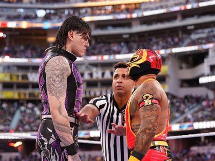 Rey and Dominik Mysterio celebrating