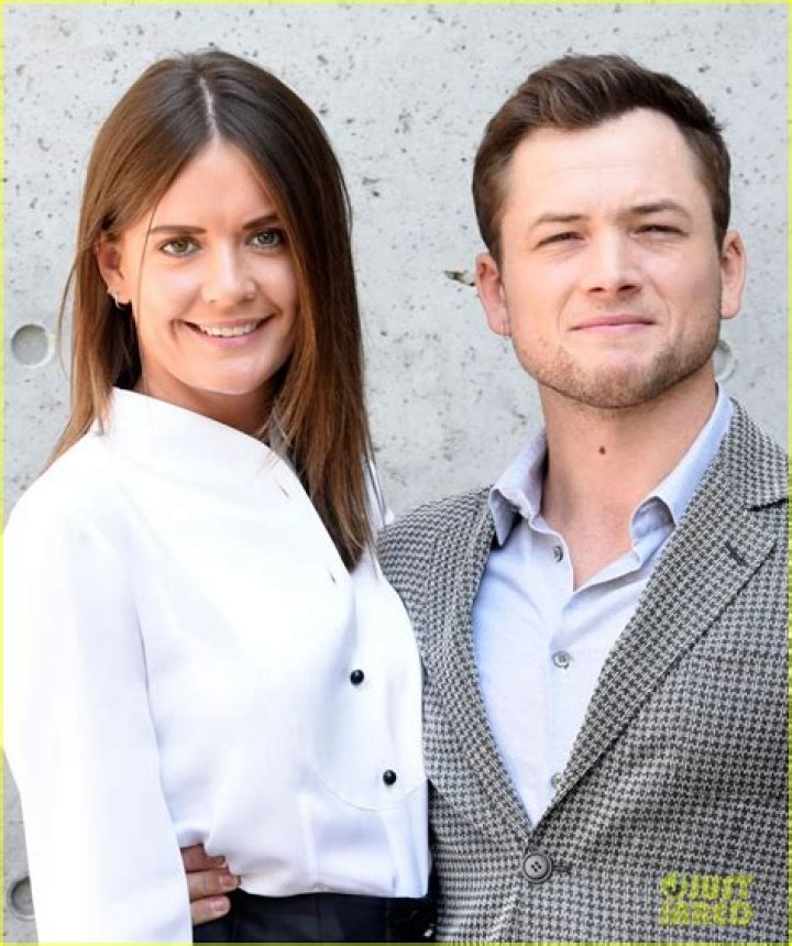 Taron Egerton & Girlfriend Emily Thomas Couple Up at Armani Show in