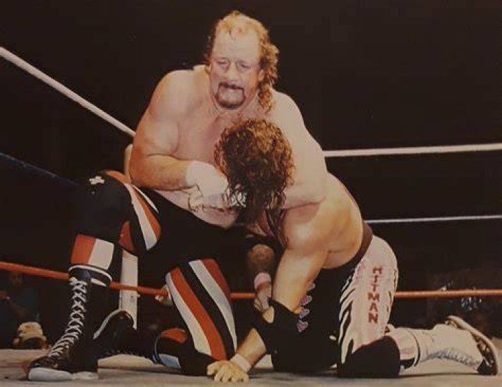 Terry Funk and Chris Candido brawl at a stable