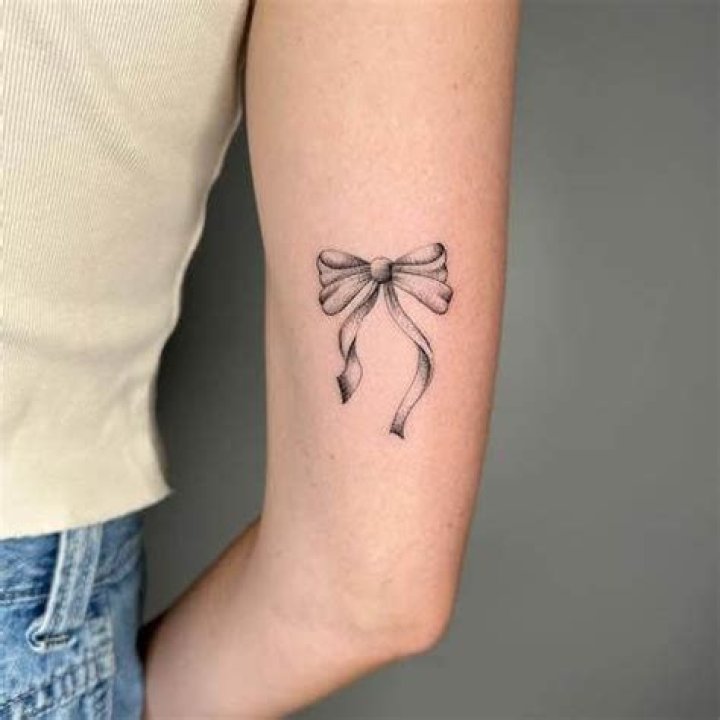 The Comprehensive Guide To Ribbon Tattoos: Meaning, Designs, And Care