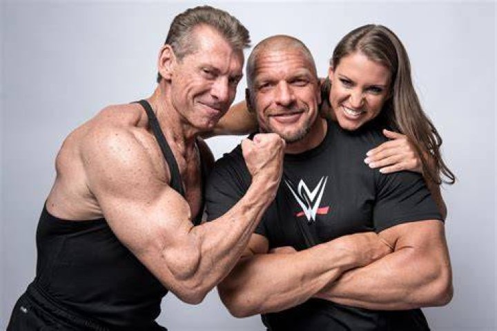 Triple H and Vince McMahon giving Custom Tribute to the Troops Championship Belt