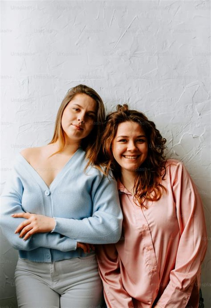 two women standing next to each other with the words everyone deserves